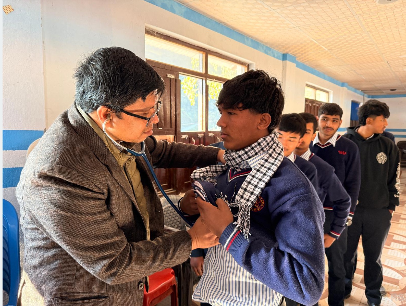 Doctor examining a student during the Free Heart Checkup Camp in Beni.